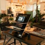 a laptop computer sitting on top of a wooden table